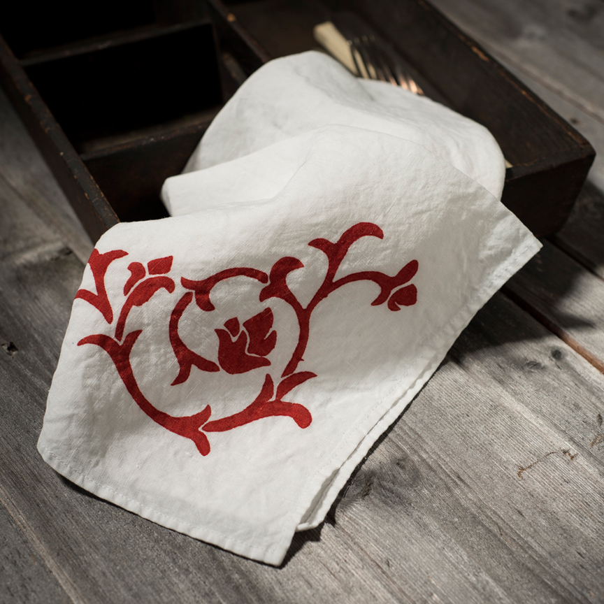 setting your table for Christmas with red hand-printed napkin