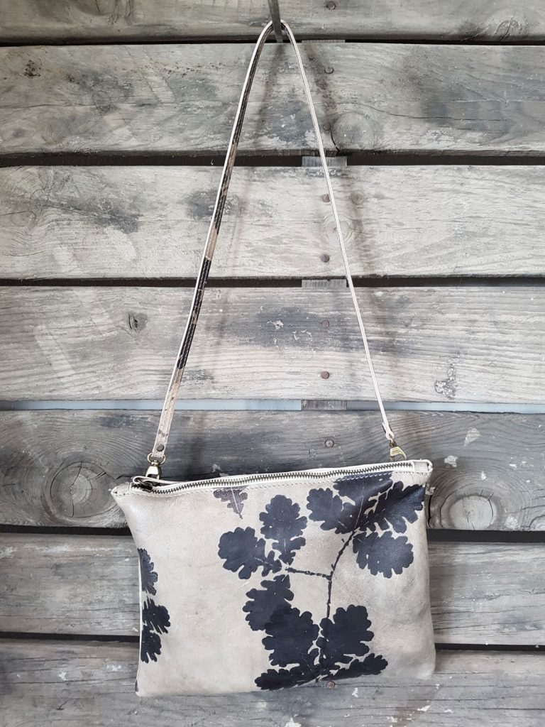 tattooed leather bag