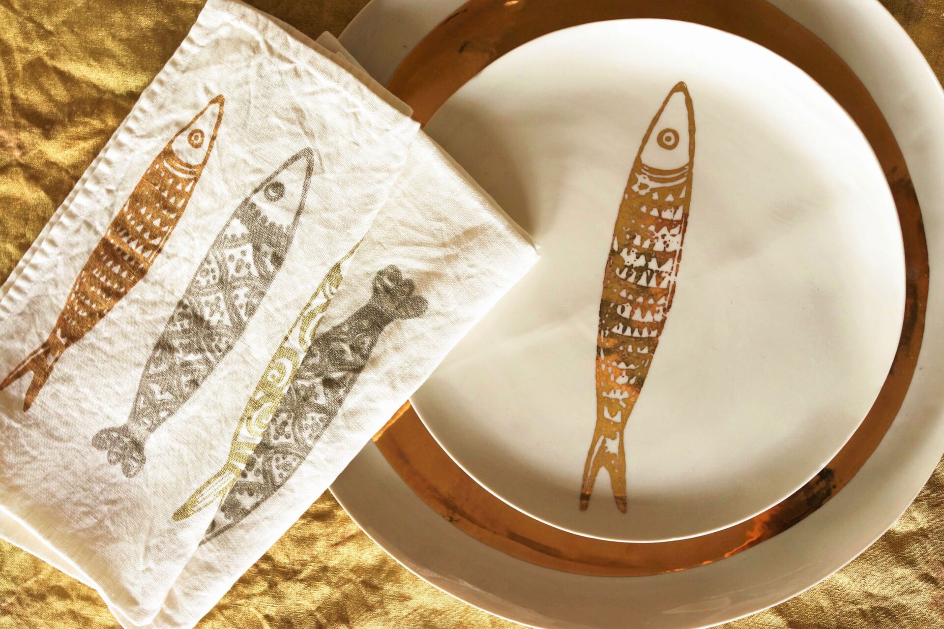 gold custom made plate and table setting