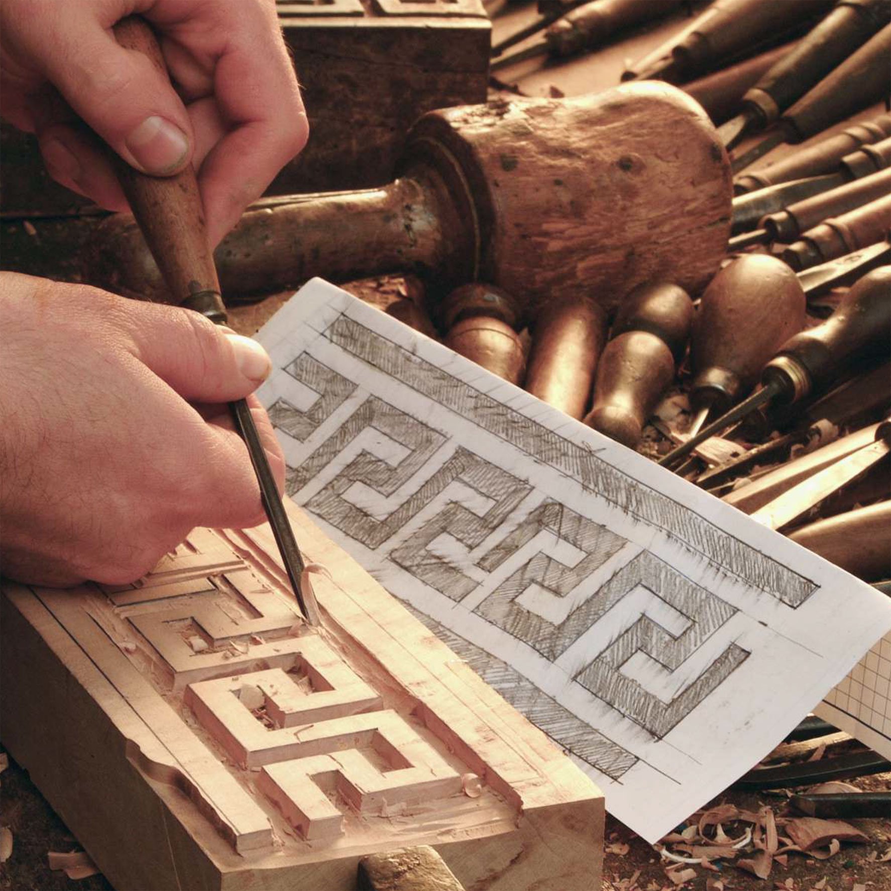 Hand-carving a wooden block for stamping