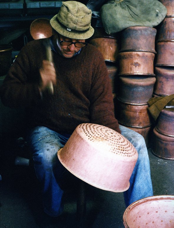 Hammering a copper pan
