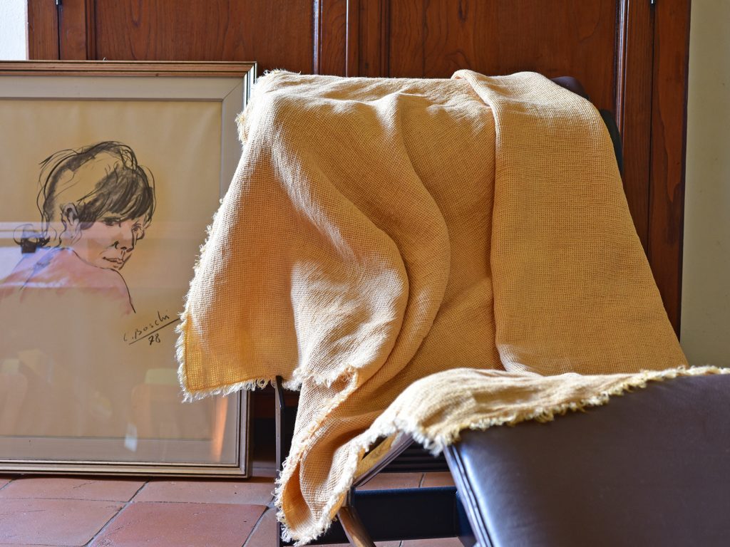Waffle Throw - Hand-painted Linen Throw - Mustard - Throw draped over indoor chair