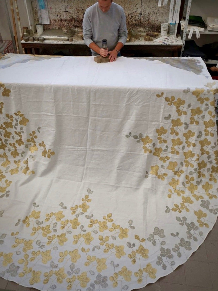 Bespoke linen tablecloth in the process of being hand-printed to create a Rovere design