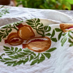 Pomegranate tea towel - image displays close up of the motifs