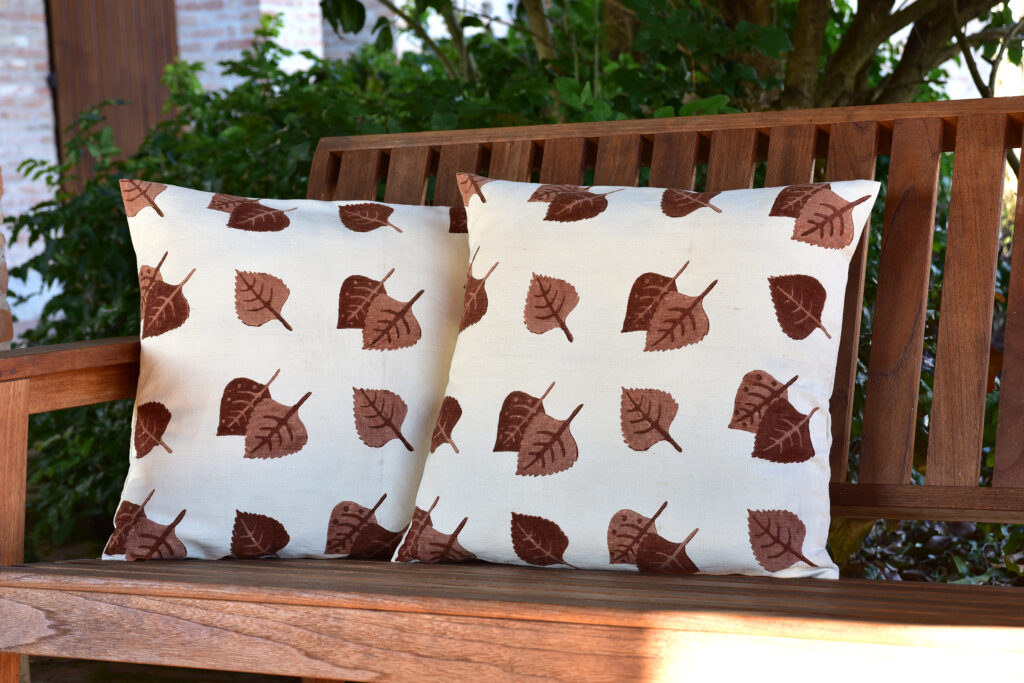 vintage cushion cover - vintage hemp linen - two cushions sitting on wooden bench