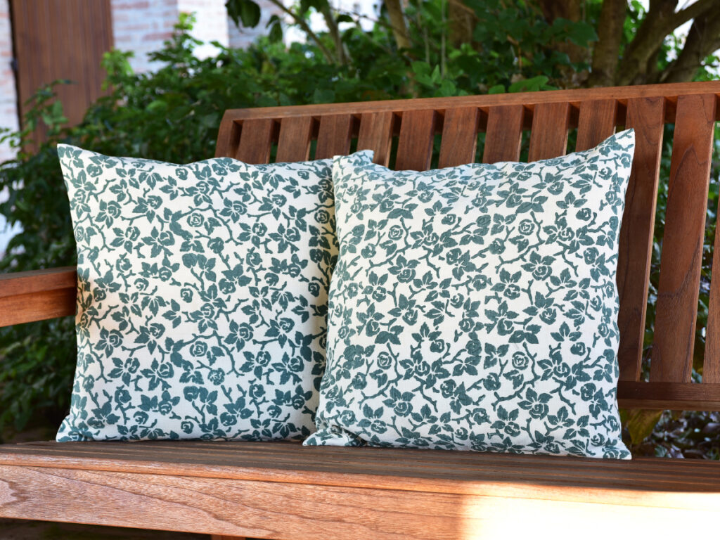 vintage cushion cover - vintage hemp linen - two cushions sitting on wooden bench