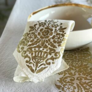 Granducale napkin folded and placed on ceramic bowl atop Granducale tablecloth