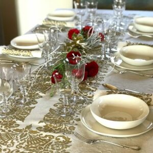 Tablescape complete with Granducale tablecloth, Granducale napkins, ceramic bowls, cutlery, glassware and red roses.