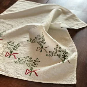 Fiocco towel laid out across wooden table