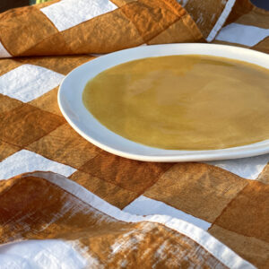 hand-painted checked line tea towel mustard with handmade porcelain side plate