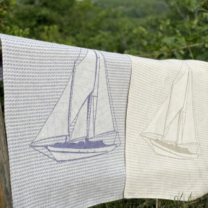 Jacquard kitchen towels laid to dry in the garden