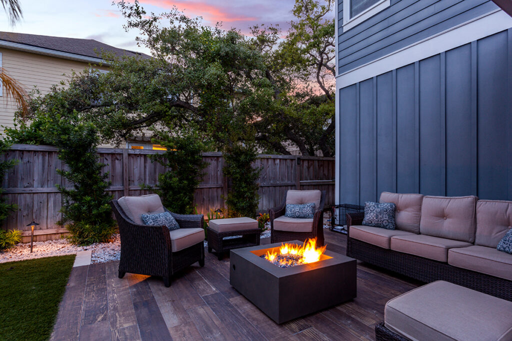 Beautiful backyard firepit at dusk with comfortable chairs