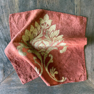 hand printed linen napkin in gold brocade motif