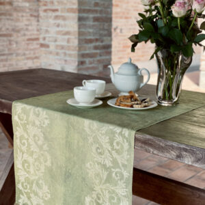 green linen napkin with vases of roses on top