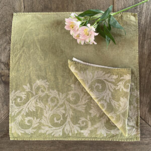 green napkin hand-printed with silver foliage motif