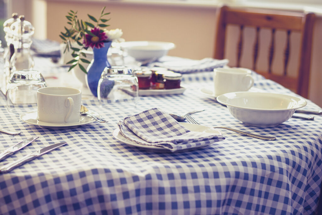 Breakfast,Table dressed with a cotton fabric tablecloth,On,Sunny,Morning