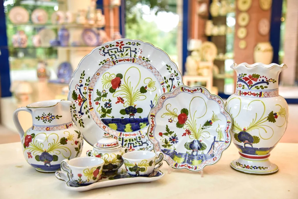 Hand-painted ceramics from Faenza on display featuring the iconic Garofano motif
