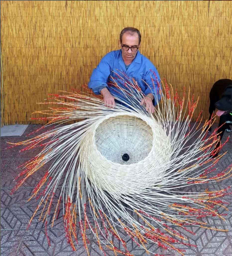 Artisan making basket by hand in Italy