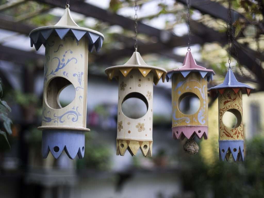 Handmade wooden bird mangiatoia