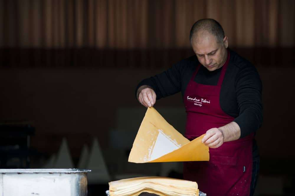 Artisan working by hand sheets of paper