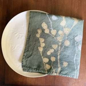 Italian linen napkin handcrafted by Bertozzi in dark-olive green