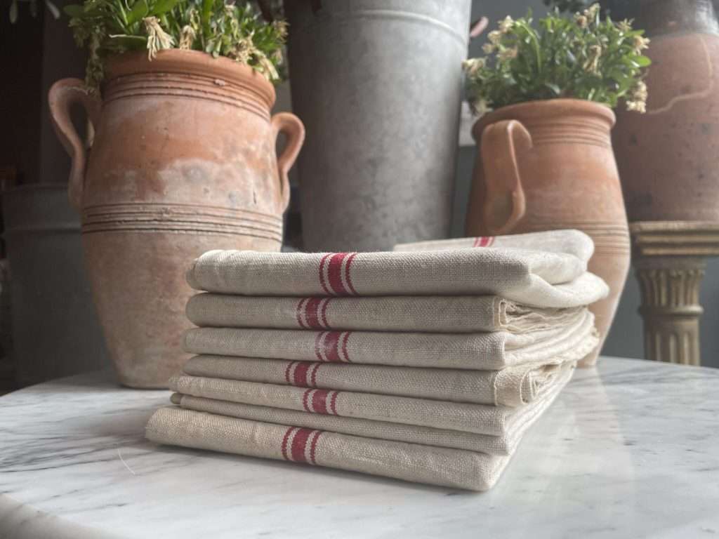 Vintage tea towel with red stripes laid on a table
