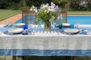 Italian dining table styled in the mediterranean style with blue hues
