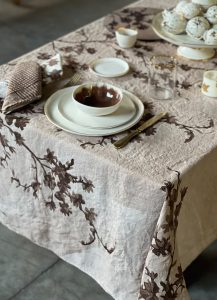 Hand-painted linen tablecloth in botanical design in brown shades
