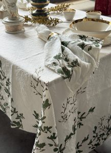Festive linen tablecloth in shimmering botanical motif